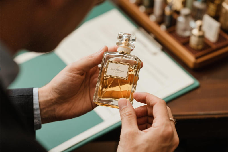 a rare vintage empty perfume bottle being appraised