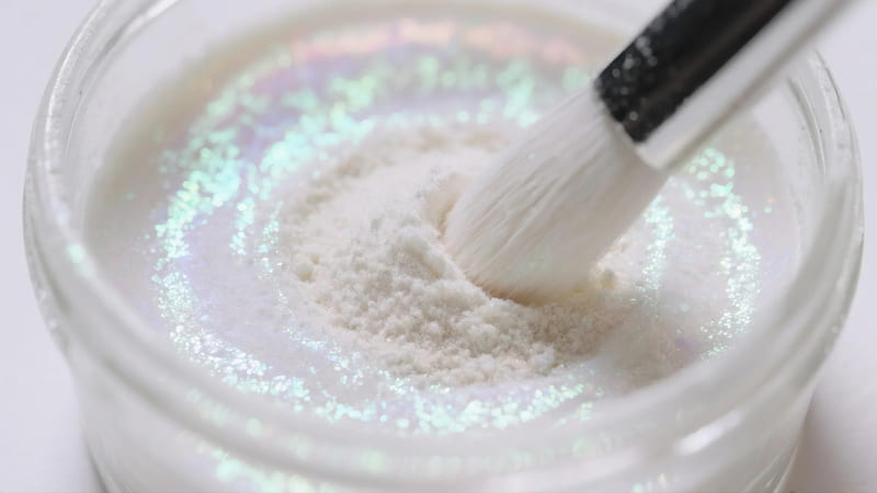 pearlescent pigment powder being mixed into a clear medium