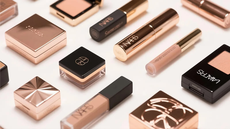collage of makeup products from brands known for beautiful packaging