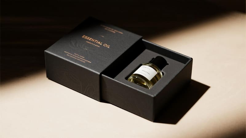 a custom essential oil box with a perfectly fitted insert holding the bottle securely