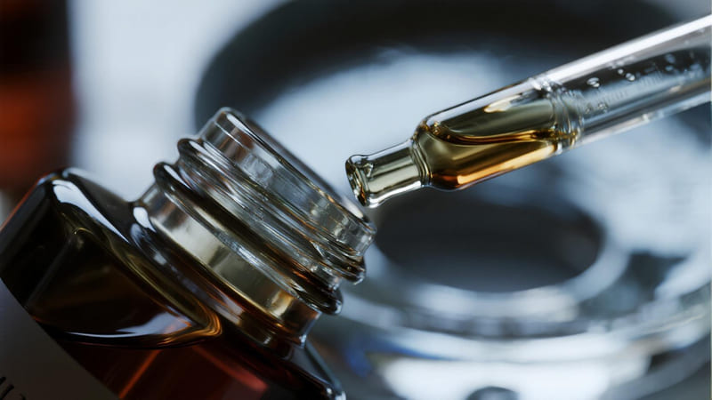 close up of a glass dropper bottle