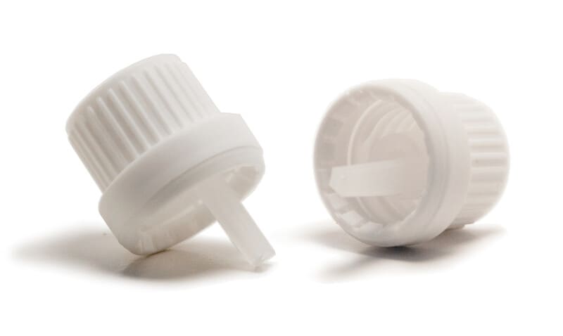 close-up of an essential oil bottle's plastic cap and orifice reducer